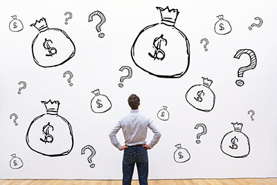 Photo of a man looking at money bag