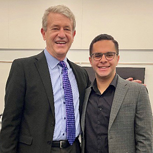 Photo of Schar School Professor, Phillip Mink and George Mason University student, John Marin Elias